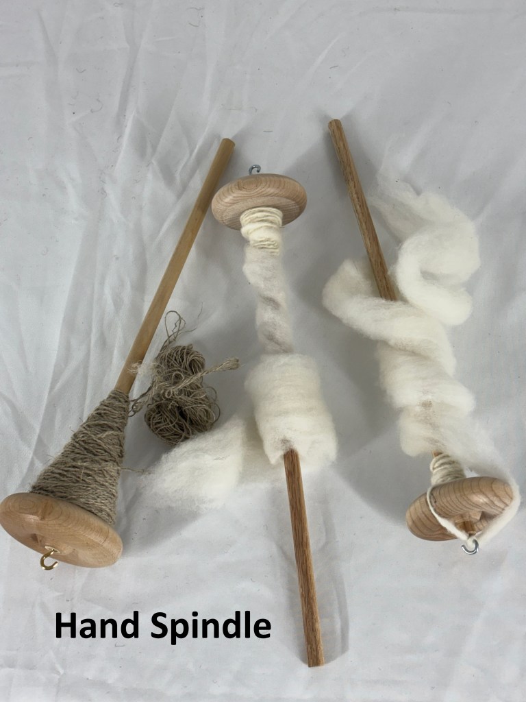 Three Hand Spindles with yarn on each