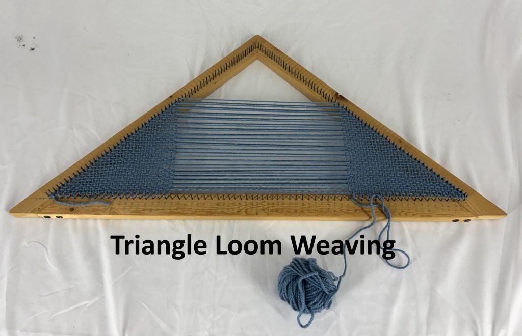 Triangle Loom with partially completed weaving project